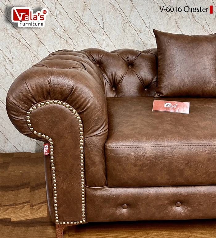 Chesterfield sofa by valas with golden show nails on handles.